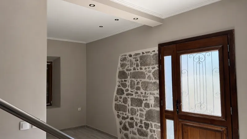 Entrance with original stone wall