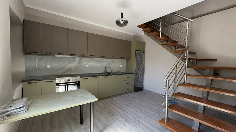 Open-plan kitchen and staircase